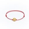 Red string bracelet with milky amber