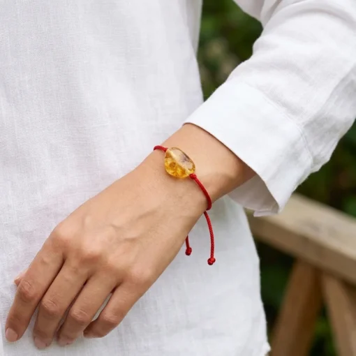 Red string bracelet with raw amber 1